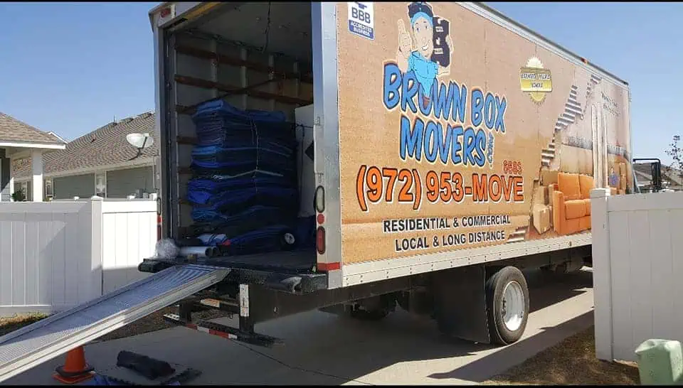 Brown Box Movers truck with its rear doors open