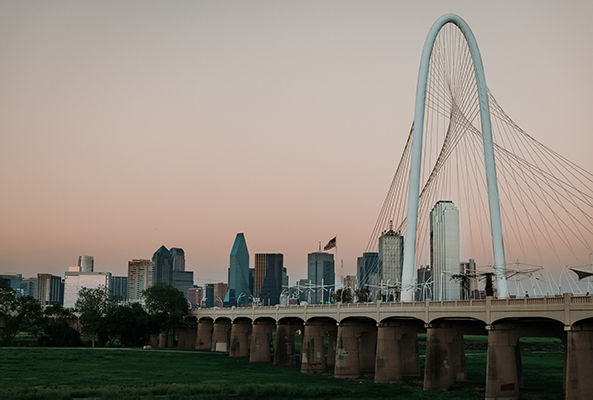 Dallas skyline and Margaret Hunt Hill Bridge at dusk